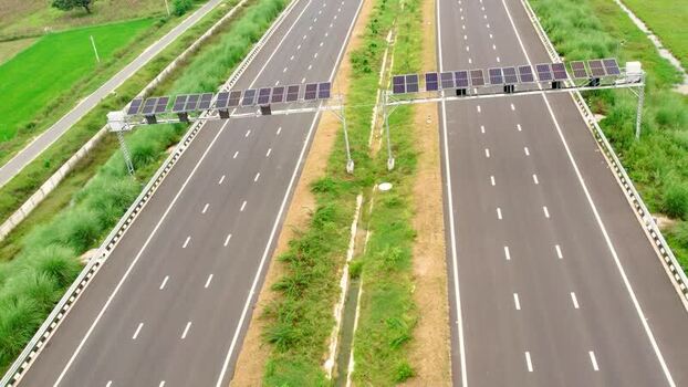 Aerial view of highway with solar panels in India. Aerial view of highway with solar panels in India.