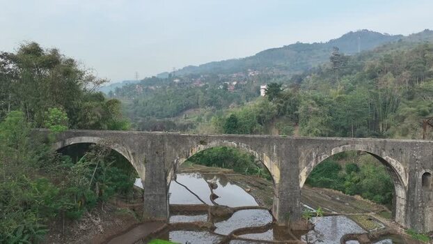 Aerial view of stone bridge over rice paddies Indonesia. Aerial view of stone bridge over rice paddies Indonesia.