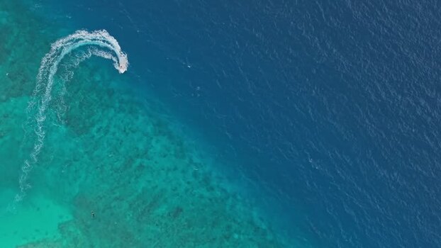 Aerial view of boat in blue water Maldives. Aerial view of boat in blue water Maldives.