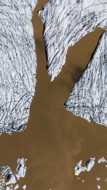 Aerial view of glacial ice meeting muddy waters a stark contrast of white and brown at Hoffellsjokull Iceland. Aerial view of glacial ice meeting muddy waters a stark contrast of white and brown at Hoffellsjokull Iceland.