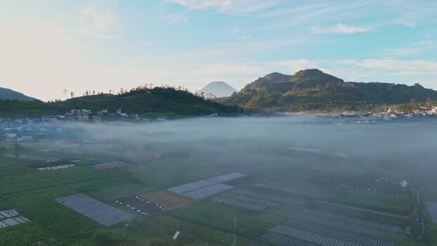 Aerial view of misty Dieng plateau and mountains Indonesia. Aerial view of misty Dieng plateau and mountains Indonesia.