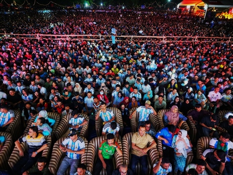 Dhaka Bangladesh 20 July 2026 Aerial view of a large crowd gathered at Mohsin Hall Playground with people sitting in chairs and standing in the field. Dhaka Bangladesh 20 July 2026 Aerial view of a large crowd gathered at Mohsin Hall Playground with people sitting in chairs and standing in the field.