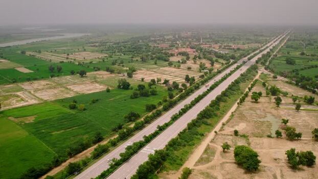 Aerial view of highway through rural landscape in India. Aerial view of highway through rural landscape in India.