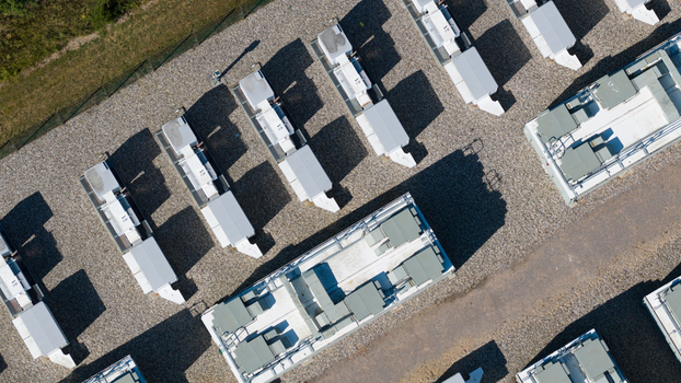 Aerial view of Pelham Storage Limited featuring rows of white industrial storage units arranged on a gravel lot in Bishop s Stortford England United Kingdom. Aerial view of Pelham Storage Limited featuring rows of white industrial storage units arranged on a gravel lot in Bishop s Stortford England United Kingdom.
