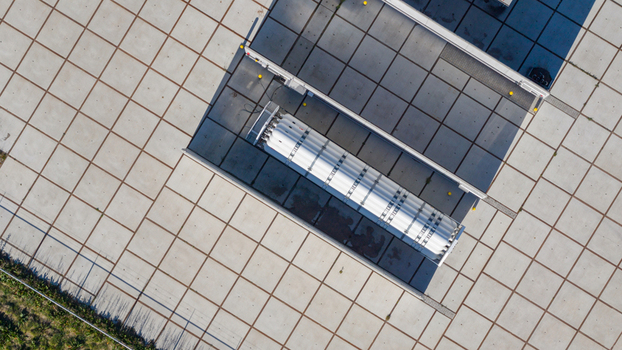 Aerial view of industrial storage tanks and infrastructure at Erflanden featuring a geometric paved ground pattern Hoogeveen Drenthe Netherlands.