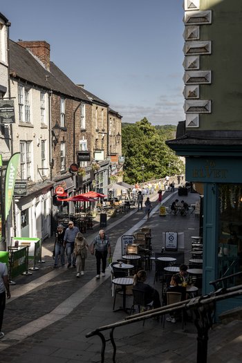 Durham United Kingdom 13 July 2026 View of Elvet street with historic buildings outdoor cafe seating and people walking on a sunny day. Durham United Kingdom 13 July 2026 View of Elvet street with historic buildings outdoor cafe seating and people walking on a sunny day.