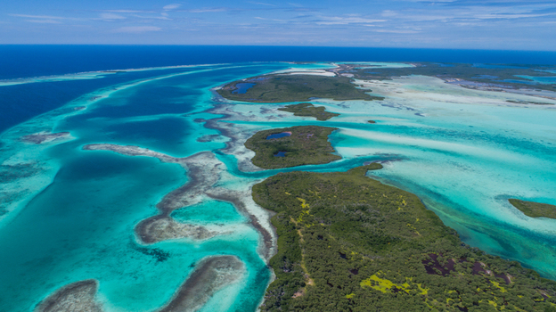 Aerial view of the Los Roques archipelago with its turquoise waters coral reefs and lush mangrove islands in Los Roques Dependencias Federale Venezuela. Aerial view of the Los Roques archipelago with its turquoise waters coral reefs and lush mangrove islands in Los Roques Dependencias Federale Venezuela.