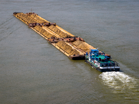Aerial view of a cargo barge transporting sand along the Danube river in Belgrade City of Belgrade Serbia. Aerial view of a cargo barge transporting sand along the Danube river in Belgrade City of Belgrade Serbia.