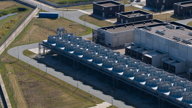 Aerial view of the GasunieAir Products nitrogen factory featuring a large array of industrial cooling fans and surrounding infrastructure in Muntendam Groningen Netherlands.