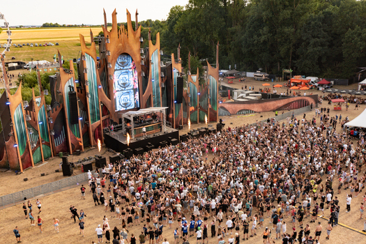 Herzogenaurach Germany 22 July 2022 Aerial view of the main stage at Open Beatz Festival with a large crowd of people dancing in front of the massive structure. Herzogenaurach Germany 22 July 2022 Aerial view of the main stage at Open Beatz Festival with a large crowd of people dancing in front of the massive structure.