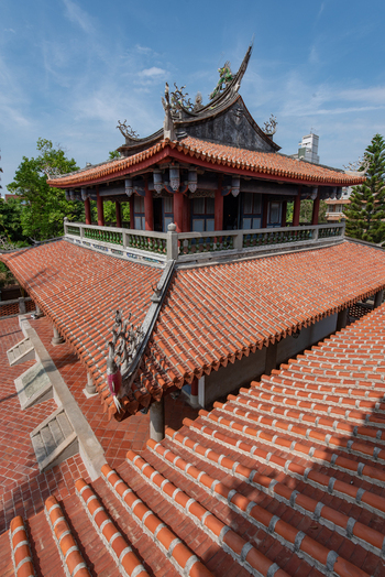 View of the traditional orange tiled roofs and ornate architectural details of Chihkan Tower Chihkan Village Tainan City Taiwan. View of the traditional orange tiled roofs and ornate architectural details of Chihkan Tower Chihkan Village Tainan City Taiwan.