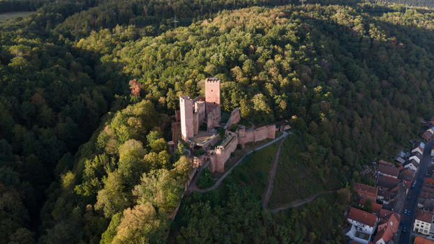 Aerial view of Henneburg castle ruins surrounded by dense forest overlooking the town of Stadtprozelten Bayern Germany. Aerial view of Henneburg castle ruins surrounded by dense forest overlooking the town of Stadtprozelten Bayern Germany.