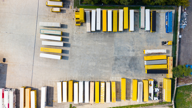 Aerial view of rows of dry van trailers parked at a logistics facility in Milan Lombardy Italy.