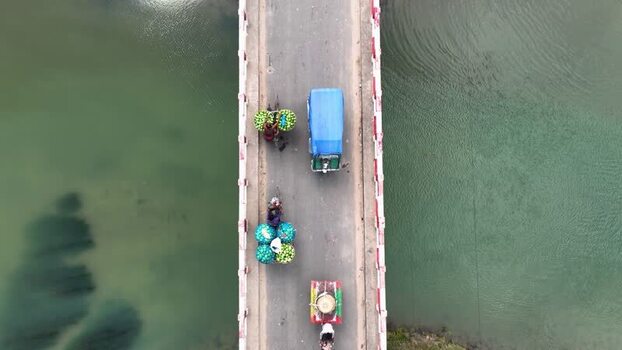 Aerial view of vehicles on a bridge in Chapai Nawabganj Bangladesh.