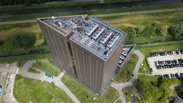 Amsterdam Noord Holland Netherlands 09 June 2026 Aerial view of Digital Realty Amsterdam AMS17 data center with rooftop cooling units green spaces and a parking lot. Amsterdam Noord Holland Netherlands 09 June 2026 Aerial view of Digital Realty Amsterdam AMS17 data center with rooftop cooling units green spaces and a parking lot.