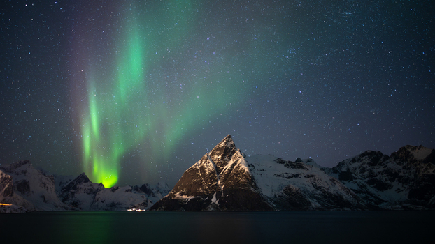 Nordland Norway 21 September 2026 Aerial view of the aurora borealis illuminating the night sky above the snow covered peaks of the Lofoten islands. Nordland Norway 21 September 2026 Aerial view of the aurora borealis illuminating the night sky above the snow covered peaks of the Lofoten islands.