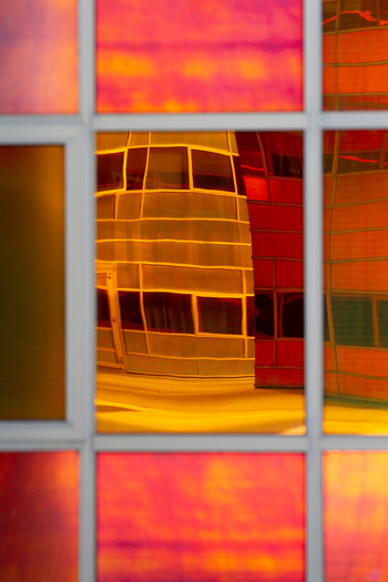 View of the captivating building facades reflected in the vibrant multi colored glass panels creating a mesmerizing visual symphony La Defense Flevoland Netherlands. View of the captivating building facades reflected in the vibrant multi colored glass panels creating a mesmerizing visual symphony La Defense Flevoland Netherlands.