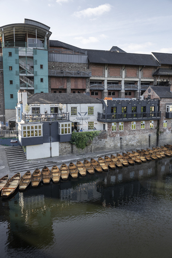 Durham England United Kingdom 13 July 2026 View of the Boar s Head riverside building with numerous wooden rowboats moored along the River Wear. Durham England United Kingdom 13 July 2026 View of the Boar s Head riverside building with numerous wooden rowboats moored along the River Wear.