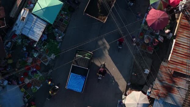 Aerial view of a street market with a pickup truck Indonesia.