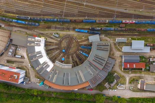 Aerial view of a railway roundhouse with a central turntable surrounded by tracks and parked trains in Breclav South Moravian Region Czechia.