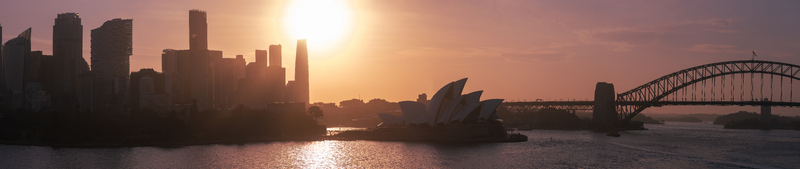 Aerial view of the Sydney Opera House and Harbour Bridge at sunset with the city skyline Sydney New South Wales Australia.