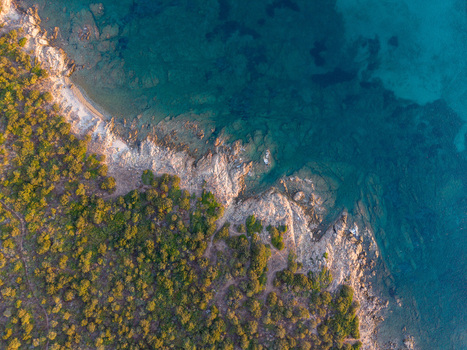 Aerial view of the rocky coastline and turquoise waters of Marinella Sardegna Italy. Aerial view of the rocky coastline and turquoise waters of Marinella Sardegna Italy.