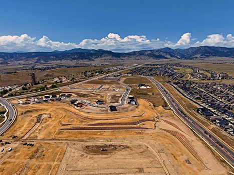 Aerial view of the Leyden residential development under construction with new homes roads and surrounding landscape in Jefferson County Colorado United States. Aerial view of the Leyden residential development under construction with new homes roads and surrounding landscape in Jefferson County Colorado United States.