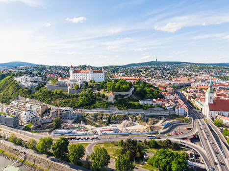 Aerial view of Bratislava Castle on a hill overlooking the city with St. Martin s Cathedral and urban architecture under a clear blue sky in Bratislava Bratislava Region Slovakia. Aerial view of Bratislava Castle on a hill overlooking the city with St. Martin s Cathedral and urban architecture under a clear blue sky in Bratislava Bratislava Region Slovakia.