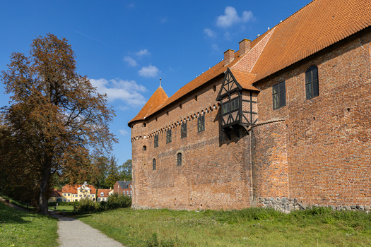 View of Nyborg Castle with its historic red brick walls timber framed bay window and surrounding green grounds in Nyborg Fyn Denmark. View of Nyborg Castle with its historic red brick walls timber framed bay window and surrounding green grounds in Nyborg Fyn Denmark.