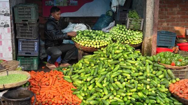 View of a man at a vegetable stall Bangladesh. View of a man at a vegetable stall Bangladesh.