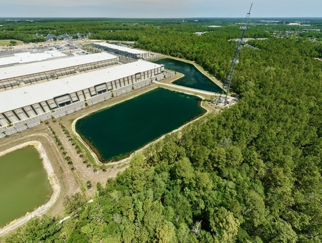 Aerial view of industrial warehouses and retention ponds near Saint Johns Parkway and International Golf Parkway in World Golf Village Florida United States. Aerial view of industrial warehouses and retention ponds near Saint Johns Parkway and International Golf Parkway in World Golf Village Florida United States.