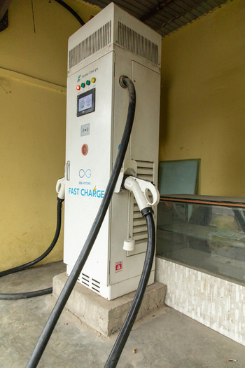 Pokhara Nepal 31 July 2026 View of an electric vehicle charging station with two charging cables and a digital display screen installed in a covered area.