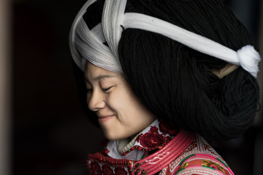 Gaoxing China 30 April 2026 View of a Long Horn Miao woman wearing a traditional massive hairpiece and embroidered clothing. Gaoxing China 30 April 2026 View of a Long Horn Miao woman wearing a traditional massive hairpiece and embroidered clothing.