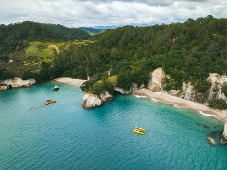 Aerial view of Cathedral Cove s dramatic cliffs embrace the turquoise ocean a symphony of nature s artistry Waikato Waikato Region New Zealand. Aerial view of Cathedral Cove s dramatic cliffs embrace the turquoise ocean a symphony of nature s artistry Waikato Waikato Region New Zealand.