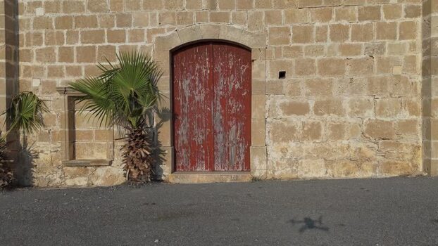 Aerial view of weathered red door in Famagusta Northern Cyprus.