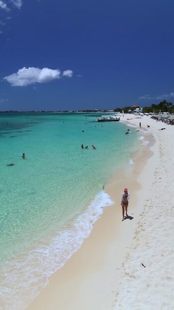 Aerial view of Grand Cayman beach with turquoise water Cayman Islands. Aerial view of Grand Cayman beach with turquoise water Cayman Islands.