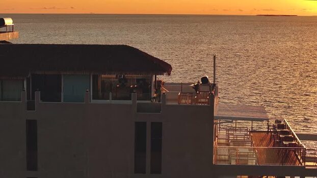 Aerial view of a resort building at sunset over Gulhi Maldives. Aerial view of a resort building at sunset over Gulhi Maldives.