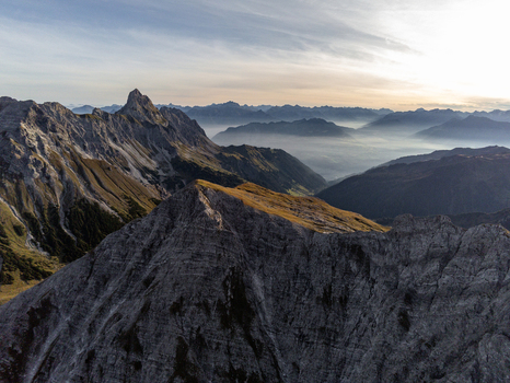 Aerial view of the rugged peaks and rocky slopes of the Ratikon Alps surrounding the Lunersee in the mountains of Vandans Vorarlberg Austria. Aerial view of the rugged peaks and rocky slopes of the Ratikon Alps surrounding the Lunersee in the mountains of Vandans Vorarlberg Austria.