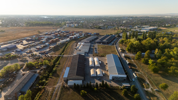 Sremska Mitrovica Vojvodina Serbia 16 September 2026 Aerial view of an industrial logistics facility with warehouses shipping containers and railway tracks. Sremska Mitrovica Vojvodina Serbia 16 September 2026 Aerial view of an industrial logistics facility with warehouses shipping containers and railway tracks.