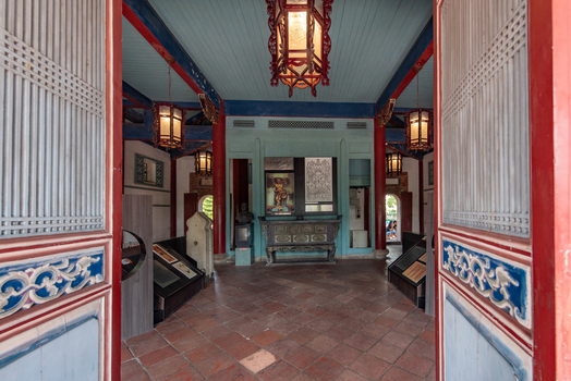 View of the interior of Chihkan Tower featuring traditional red pillars ornate hanging lanterns and historical exhibits in Chihkan Village Tainan City Taiwan. View of the interior of Chihkan Tower featuring traditional red pillars ornate hanging lanterns and historical exhibits in Chihkan Village Tainan City Taiwan.