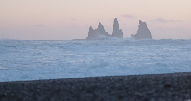 View of Reynisdrangar sea stacks in Iceland. View of Reynisdrangar sea stacks in Iceland.