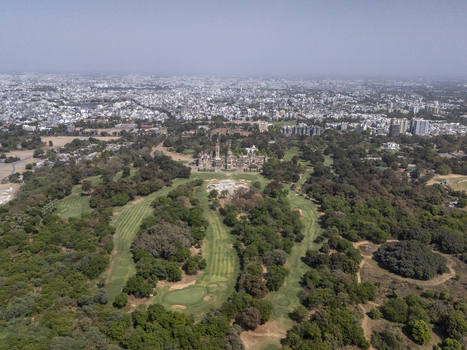 Vadodara India 14 March 2026 Aerial view of Laxmi Vilas Palace surrounded by lush green gardens and a golf course with the city skyline in the background. Vadodara India 14 March 2026 Aerial view of Laxmi Vilas Palace surrounded by lush green gardens and a golf course with the city skyline in the background.
