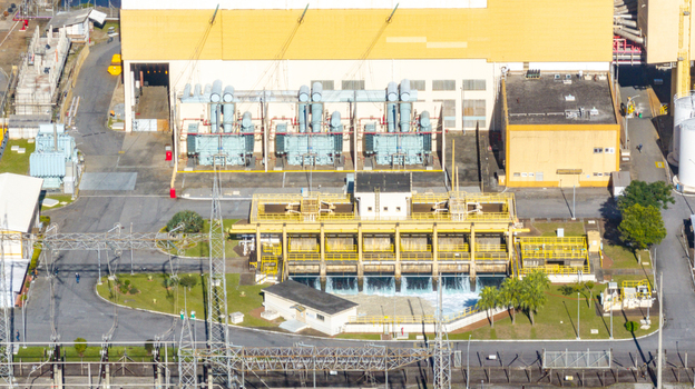 Aerial view of the Nuclear Power Plant Angra 2 featuring industrial buildings electrical transformers and cooling water discharge systems in Angra dos Reis Rio de Janeiro Brazil.