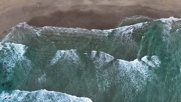 Aerial view of waves crashing on Antilla beach Spain.