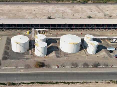 Grand Junction Colorado United States 03 July 2026 Aerial view of storage tanks at an industrial facility with white cylindrical tanks piping and a long warehouse structure. Grand Junction Colorado United States 03 July 2026 Aerial view of storage tanks at an industrial facility with white cylindrical tanks piping and a long warehouse structure.