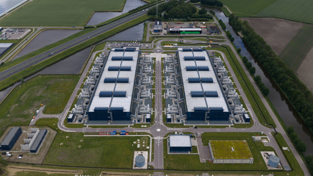 Aerial view of the Agriport industrial facility and data center complex with symmetrical buildings and rooftop cooling units in Middenmeer Noord Holland Netherlands. Aerial view of the Agriport industrial facility and data center complex with symmetrical buildings and rooftop cooling units in Middenmeer Noord Holland Netherlands.