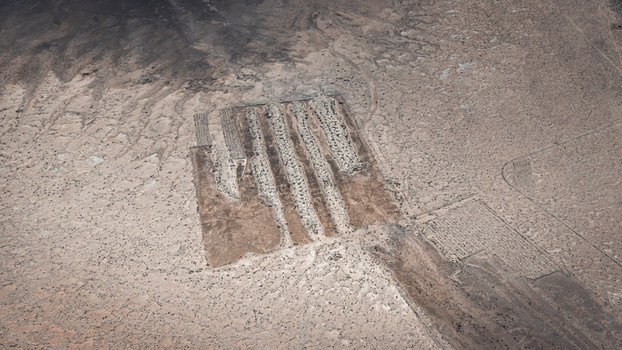 Aerial view of the abstract geometric patterns of salt pans and arid terrain in the remote landscape of Useless Loop Western Australia Australia. Aerial view of the abstract geometric patterns of salt pans and arid terrain in the remote landscape of Useless Loop Western Australia Australia.