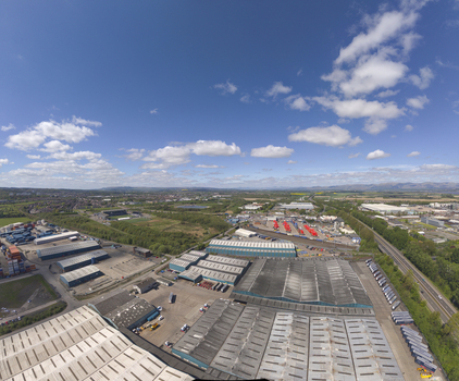 Grangemouth United Kingdom 04 May 2026 Aerial view of large industrial warehouses shipping containers and a logistics park under a blue sky with scattered clouds. Grangemouth United Kingdom 04 May 2026 Aerial view of large industrial warehouses shipping containers and a logistics park under a blue sky with scattered clouds.