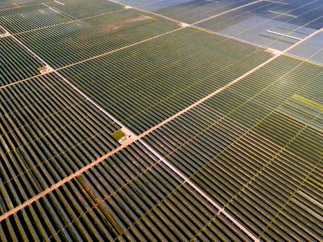 Aerial view of Limondale Solar Farm with rows of photovoltaic panels arranged in a grid pattern across the landscape in Balranald New South Wales Australia. Aerial view of Limondale Solar Farm with rows of photovoltaic panels arranged in a grid pattern across the landscape in Balranald New South Wales Australia.