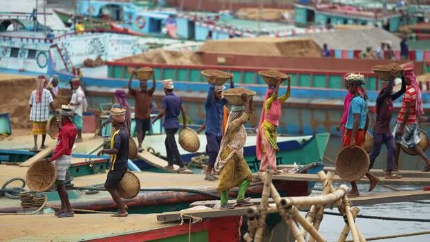 View of workers carrying sand baskets at Aminbazar Bangladesh. View of workers carrying sand baskets at Aminbazar Bangladesh.